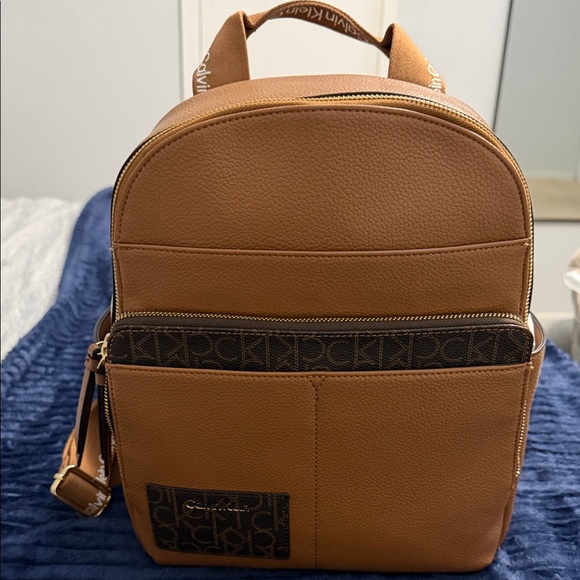Calvin Klein Handbags - Calvin Klein Brown Backpack with Logo Accent